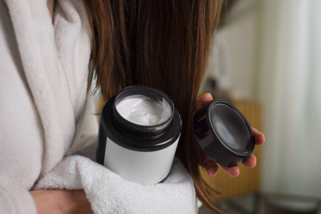 Bouncy Hair Care-Girl Applying Leave-In Conditioner