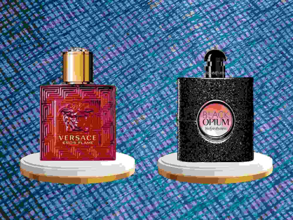 Bottles of Eros Flame Versace EDP and Black Opium Yves Saint EDP Spray for comparison.